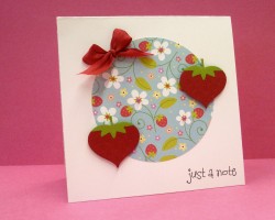 I used DOODLEBUG BERRY BLUE AGAIN and a red silk ribbon (which will be online by the end of the week) as well as the yummy HEARTY strawberries from the flirty set.  I also used the XTRA LARGE CIRCLE PUNCH BY MARVY