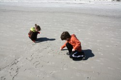 kidlets writing in the sand