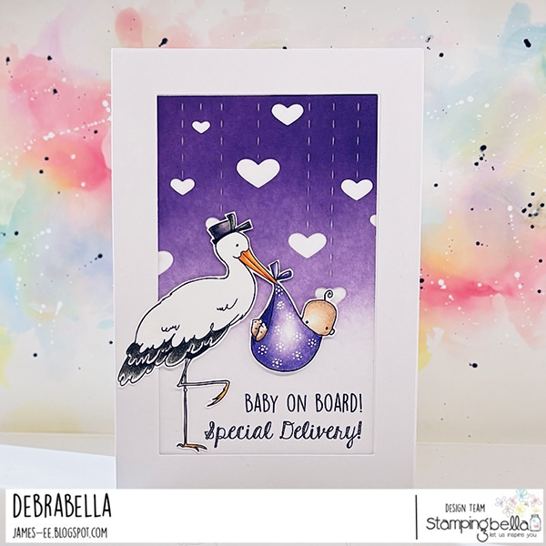 Handmade card design featuring Stamping Bella Delivery From the Stork cling mounted rubber stamp and sentiments from the Baby Sentiment Set cling mounted rubber stamp set. The card has a white border with a central rectangular panel that has a gradient purple background with white hearts. A stork wearing a black delivery hat is carrying a baby wrapped in a purple blanket. Below the image, the text reads 'BABY ON BOARD! Special Delivery!' The card was designed by Debrabella for the Stamping Bella design team.